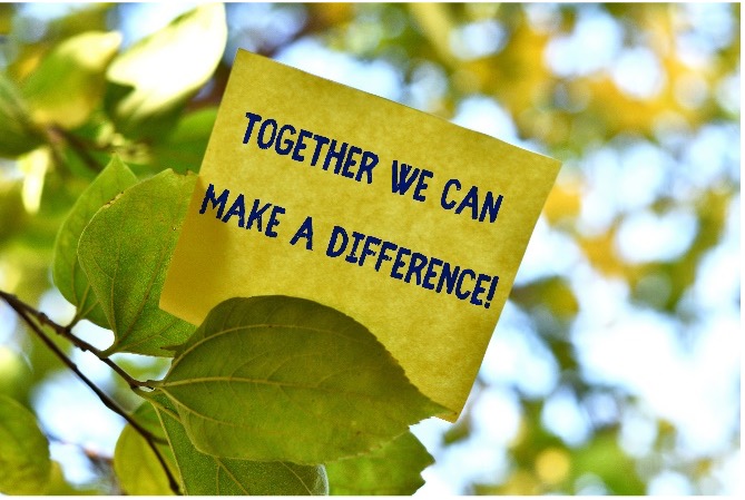 Sticky note that says "Together we can make a difference" stuck in a tree